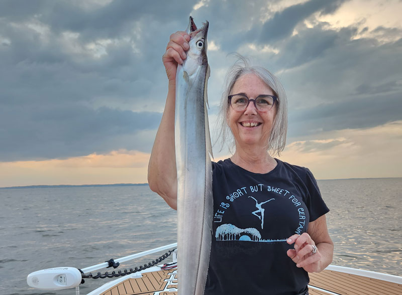 angler with a weird fish she caught